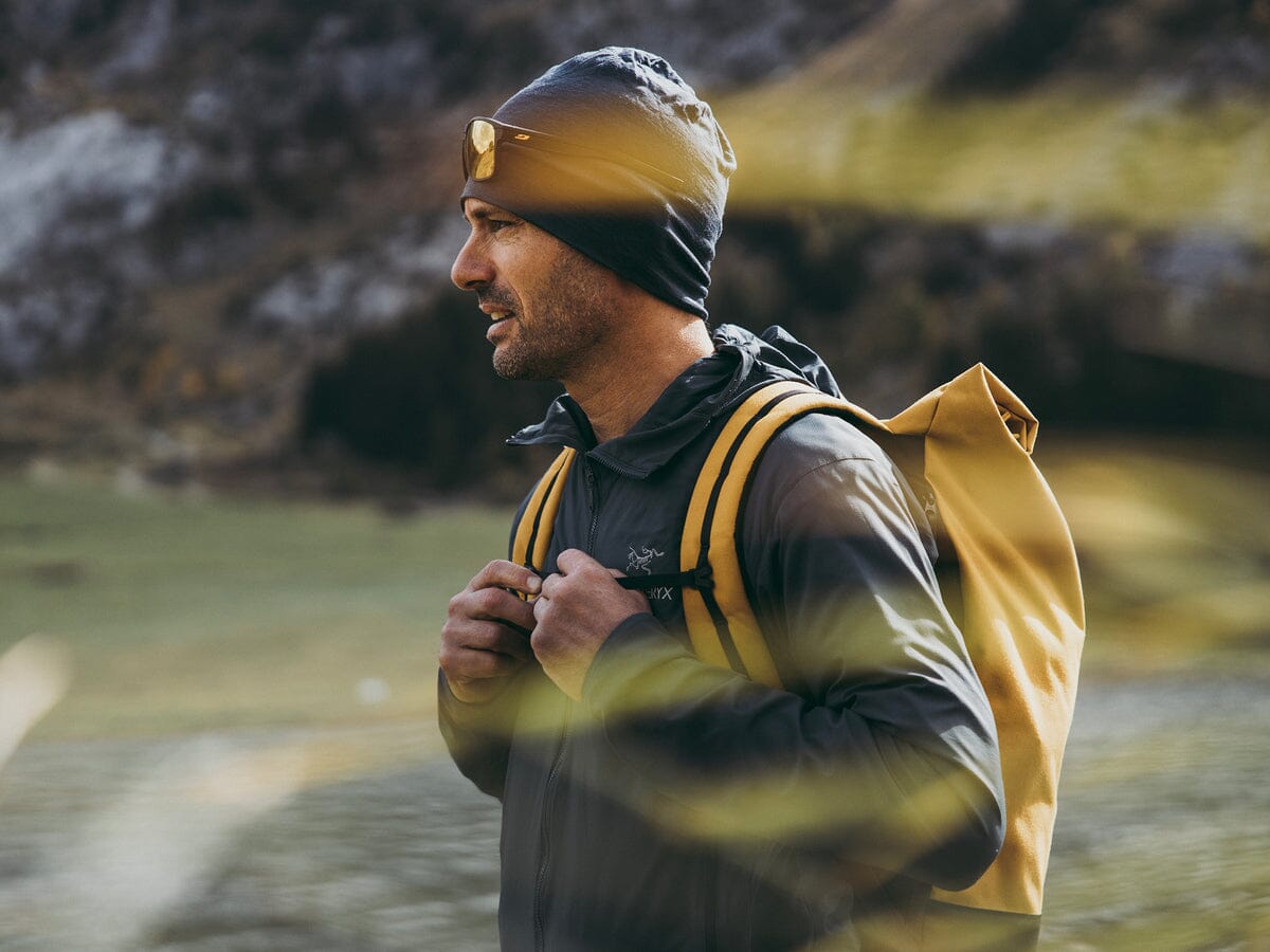 hiker wearing yellow wanaka backpack from mero mero