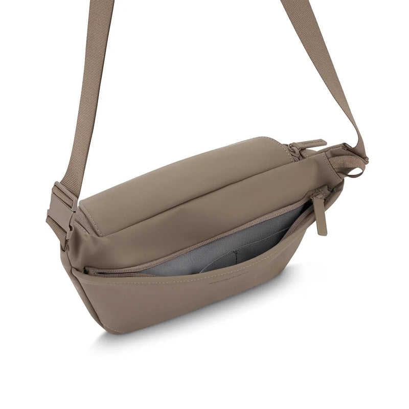 Anti-theft back pocket open on the walnut Bali crossbody, with two flat organizer pockets