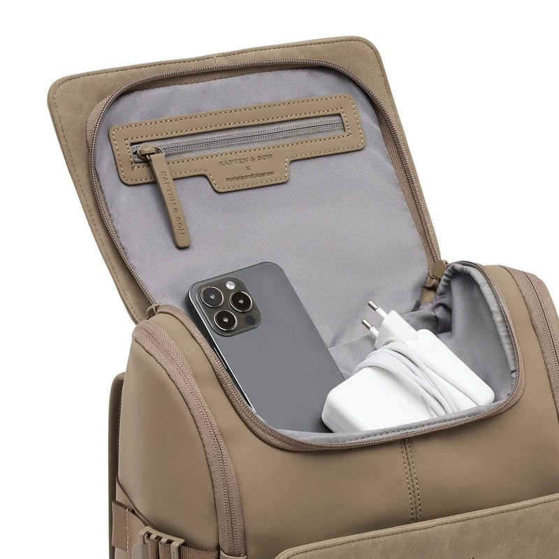 Phone and charger in the quick-access top pocket of the walnut Bali Medium