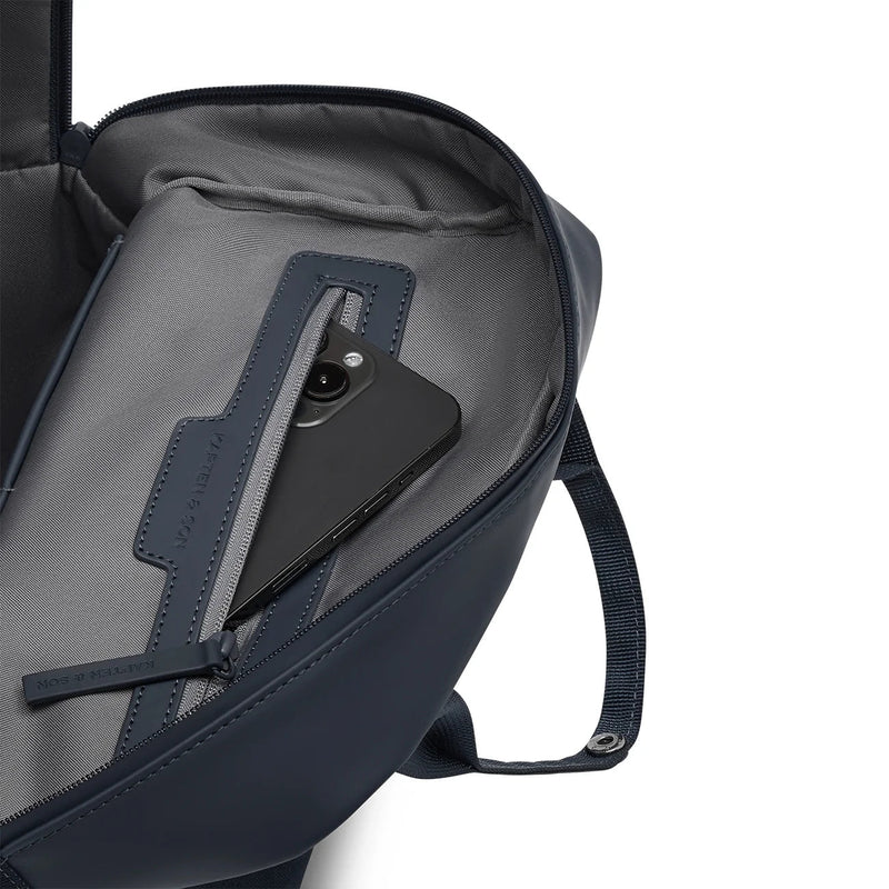Interior zipped phone pocket close-up on the navy version