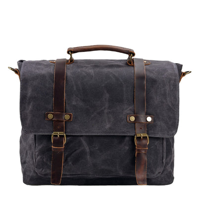 dark grey canvas and leather messenger bag front