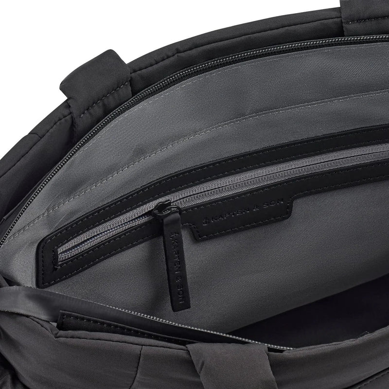 Interior close-up with zip pocket and soft grey lining