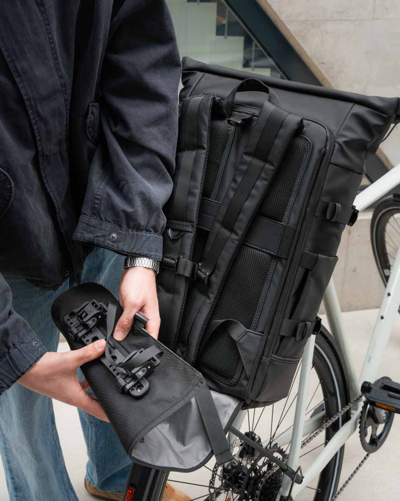 Rolling up the Click & Go panel with its hooks to slide it into the bottom compartment