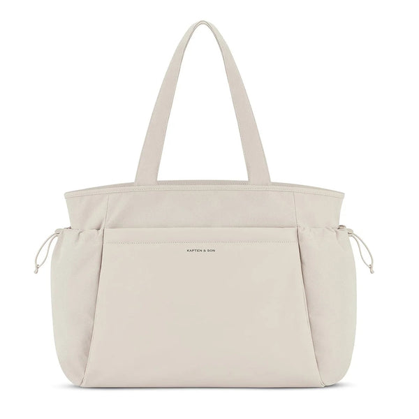 Kapten & Son Hellvi Pro Large shoulder bag in sandstone, vegan PU front panel and side pockets with elastic drawcord