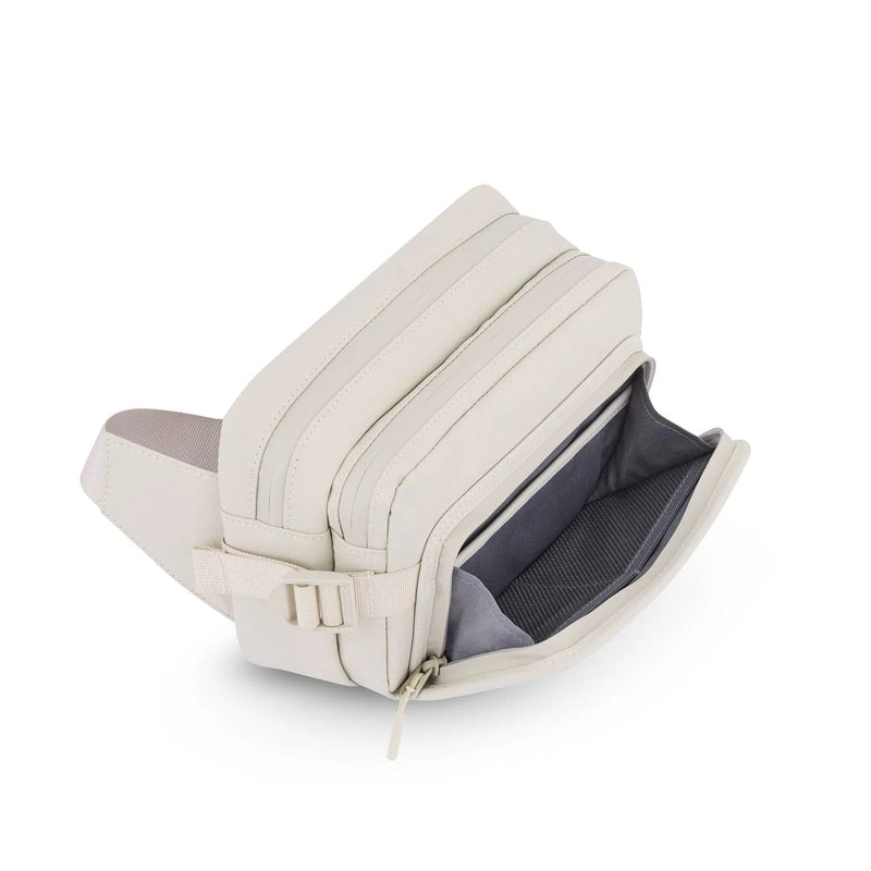 Front pocket unzipped and folded open, sandstone