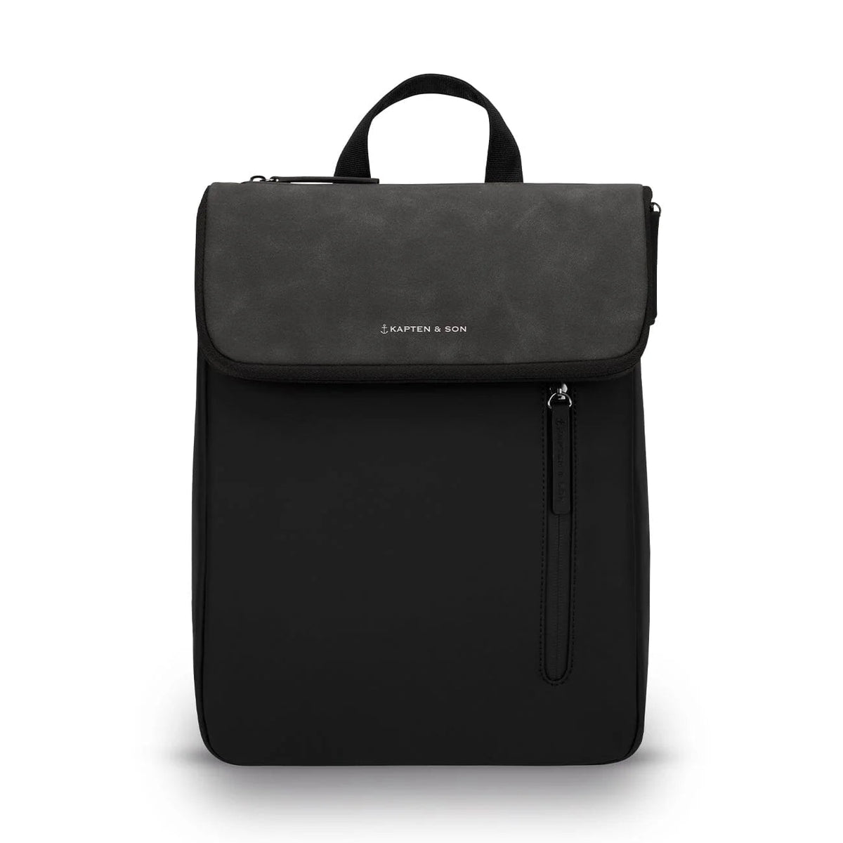 Kapten & Son Vallen Backpack in black: slim vegan mini backpack with a textured flap and vertical zip pocket