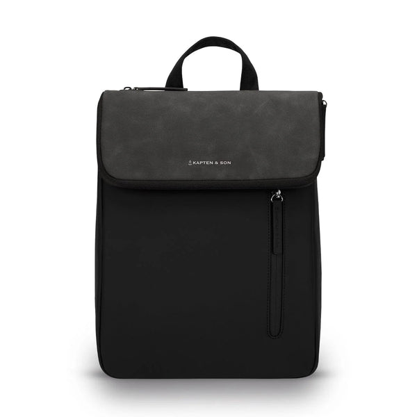 Kapten & Son Vallen Backpack in black: slim vegan mini backpack with a textured flap and vertical zip pocket