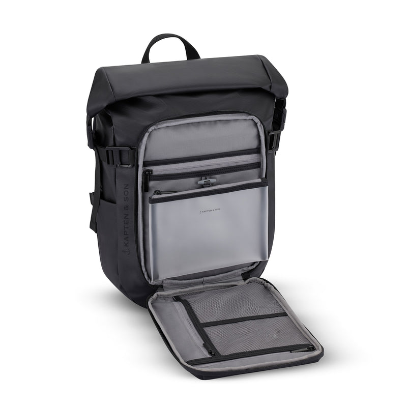 Front pocket open revealing laptop sleeve and organizer compartments