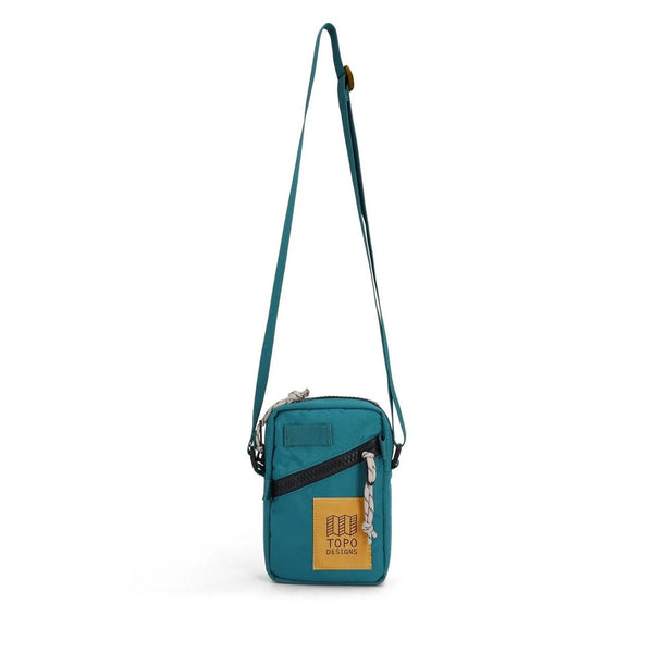 Topo Designs Mini Shoulder Bag in spruce — front view with deep teal body and pattern strap