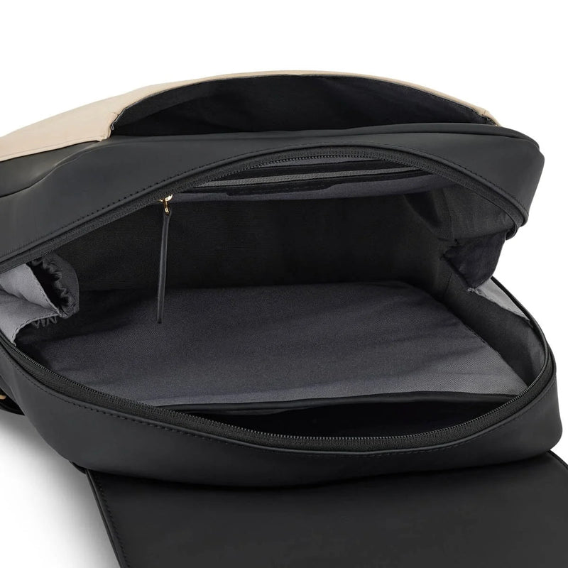 Inner zip pocket at the top and laptop sleeve against the back of the cream black Tromso