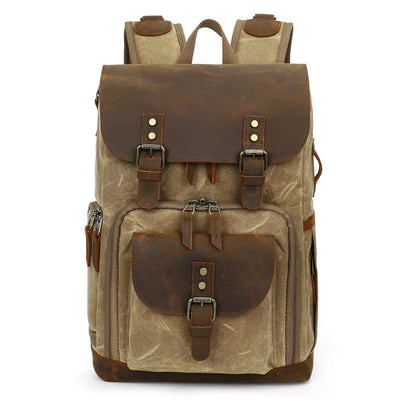 Vintage Leather Camera Backpack, ideal to store a camera kit, featuring a front pouch for small accessories, a side pocket for additional items and a top compartment to maximize space
