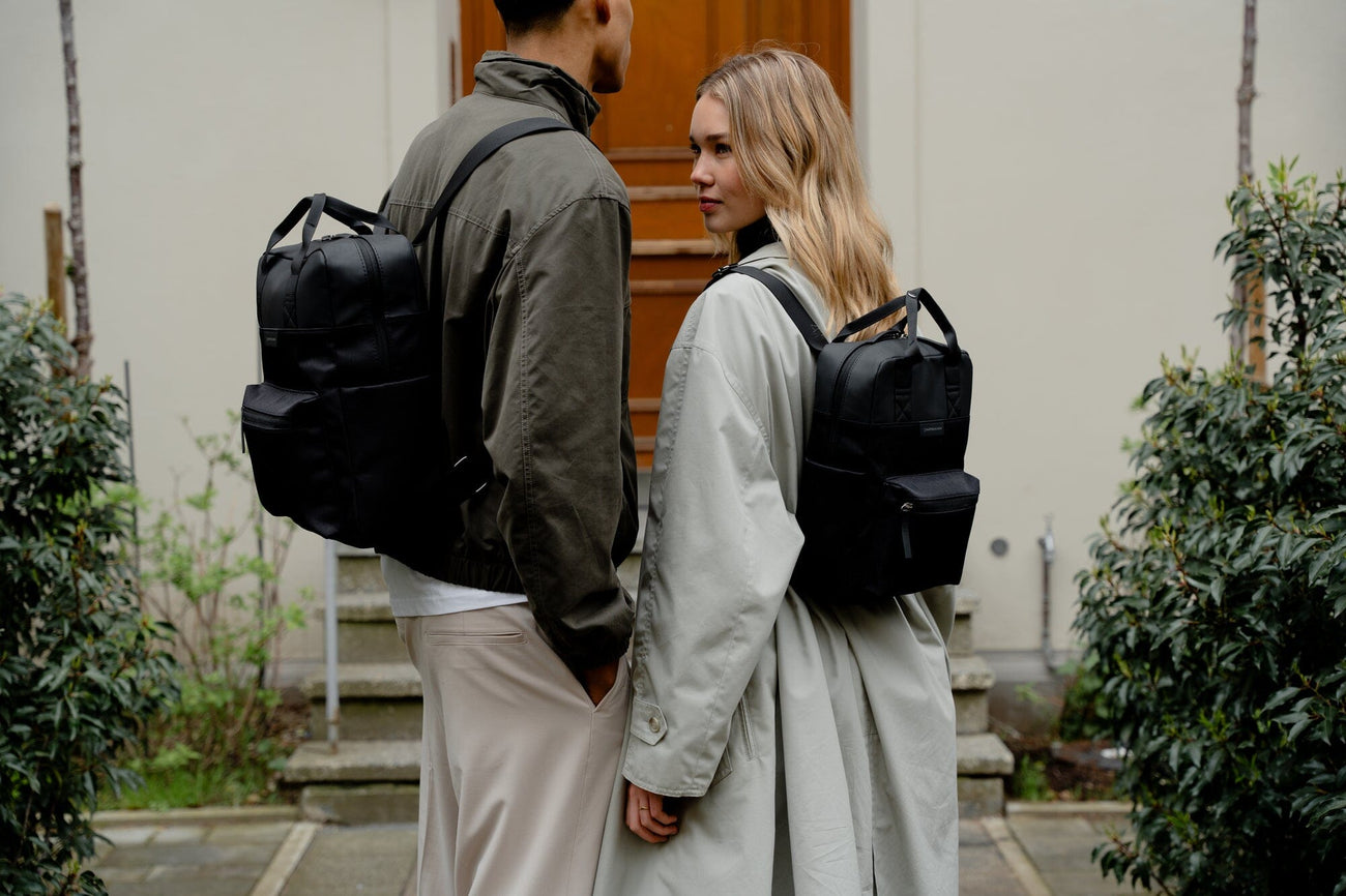 man and female models wearing kapten and son backpacks