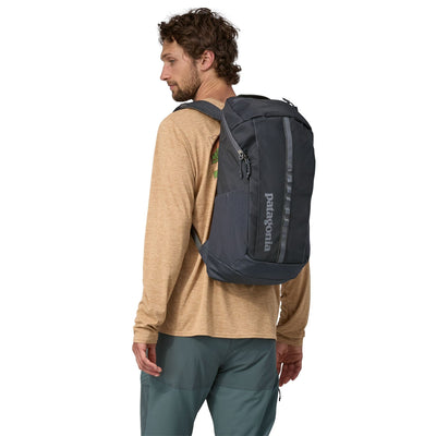 man model wearing the Black Hole Pack 25L in smolder blue, back view