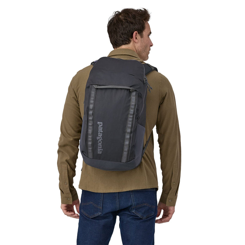 man model wearing the Black Hole Pack 32L in smolder blue, back view