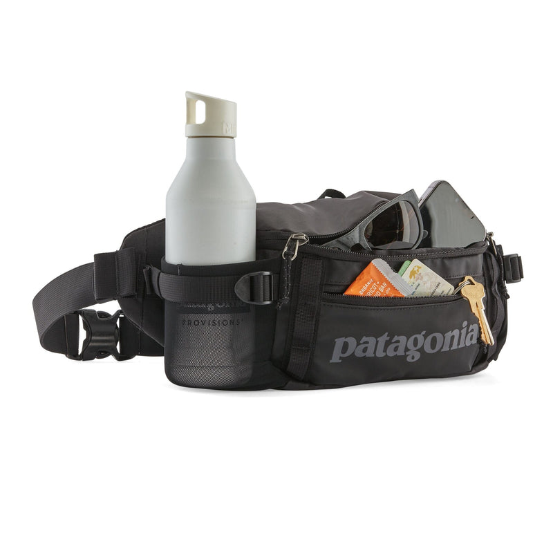 Black Hole Waist Pack 5L details, front zipped pocket, side stretch mesh pockets, daisy chain