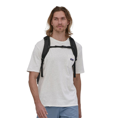 man model wearing the Refugio Daypack 30L in black, front view