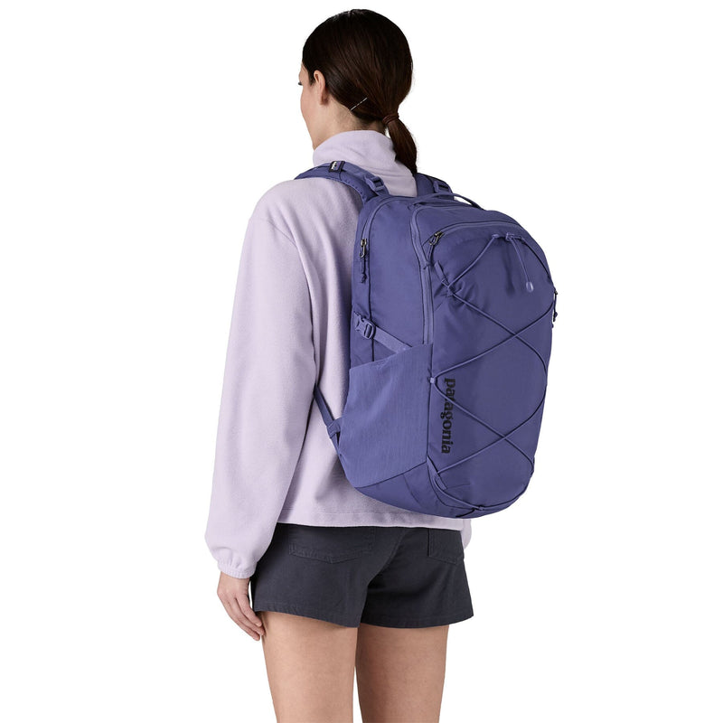 woman model wearing the Refugio Daypack 30L in solstice purple, back view