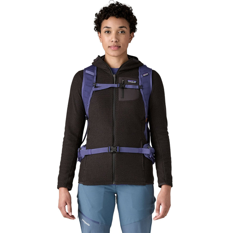 woman wearing the terravia pack 28 in solstice purple, front view