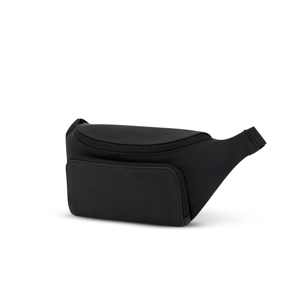Three-quarter view of the black Bali crossbody showing the curved shape and front organizer pocket