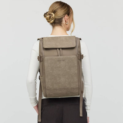 Back view of woman wearing the Bali Medium Walnut backpack by Kapten & Son, showcasing ergonomic straps and structured silhouette