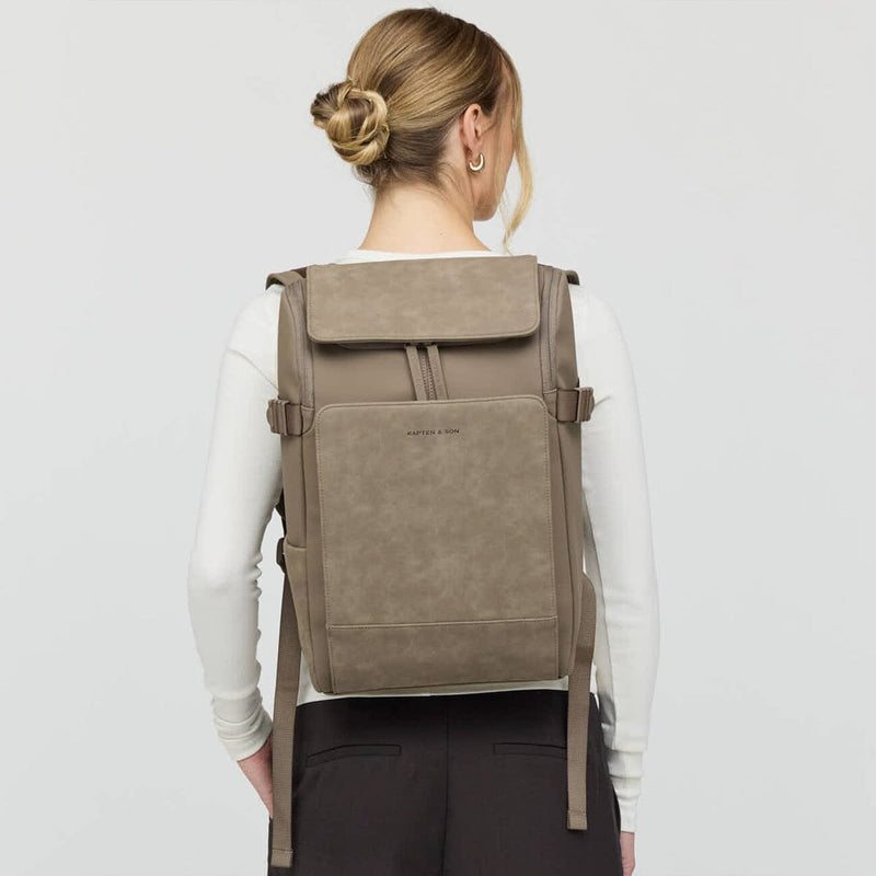 Back view of woman wearing the Bali Medium Walnut backpack by Kapten & Son, showcasing ergonomic straps and structured silhouette