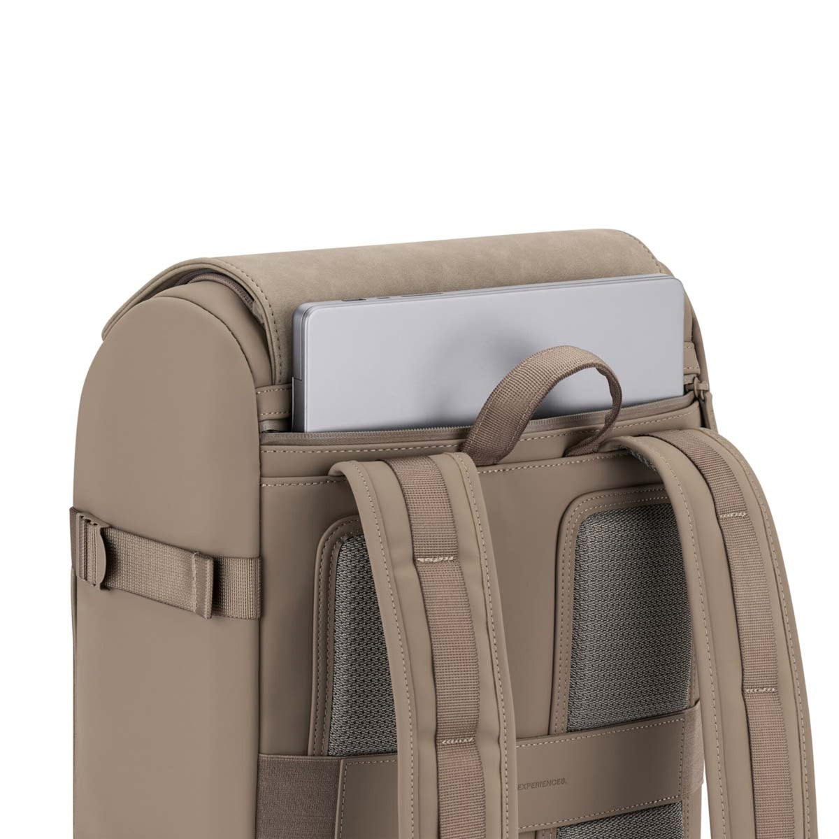 A laptop sliding into the back compartment of the walnut Kapten & Son Bali Pro