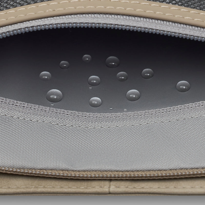 Wet pocket of the Bali Pro in Walnut with water droplets on its coated lining