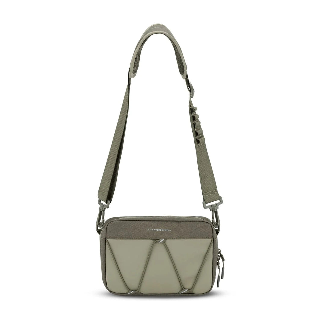 Forest green Banff crossbody hanging from its strap — full shoulder strap view