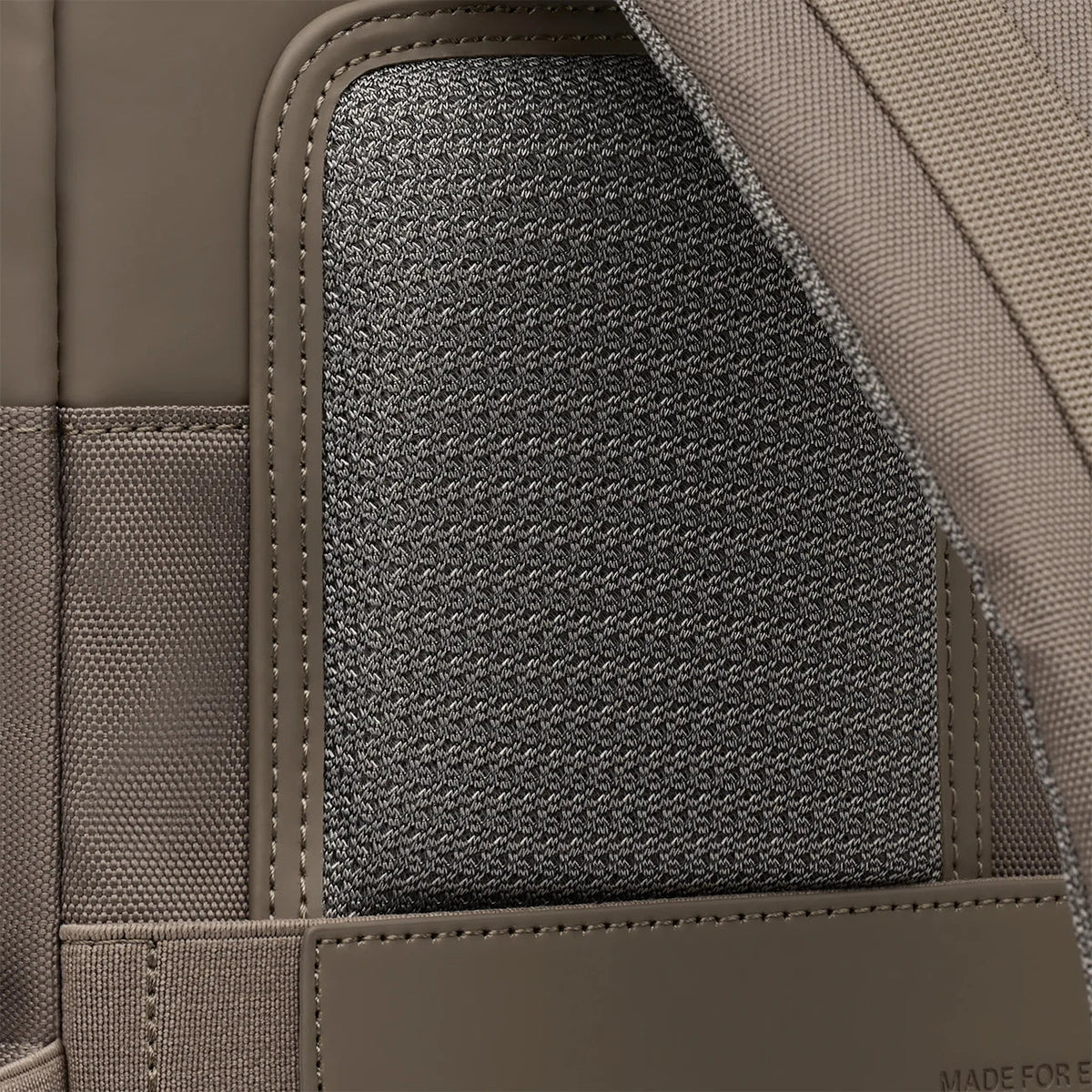 Padded back panel covered in breathable mesh on the walnut Bergen Pro