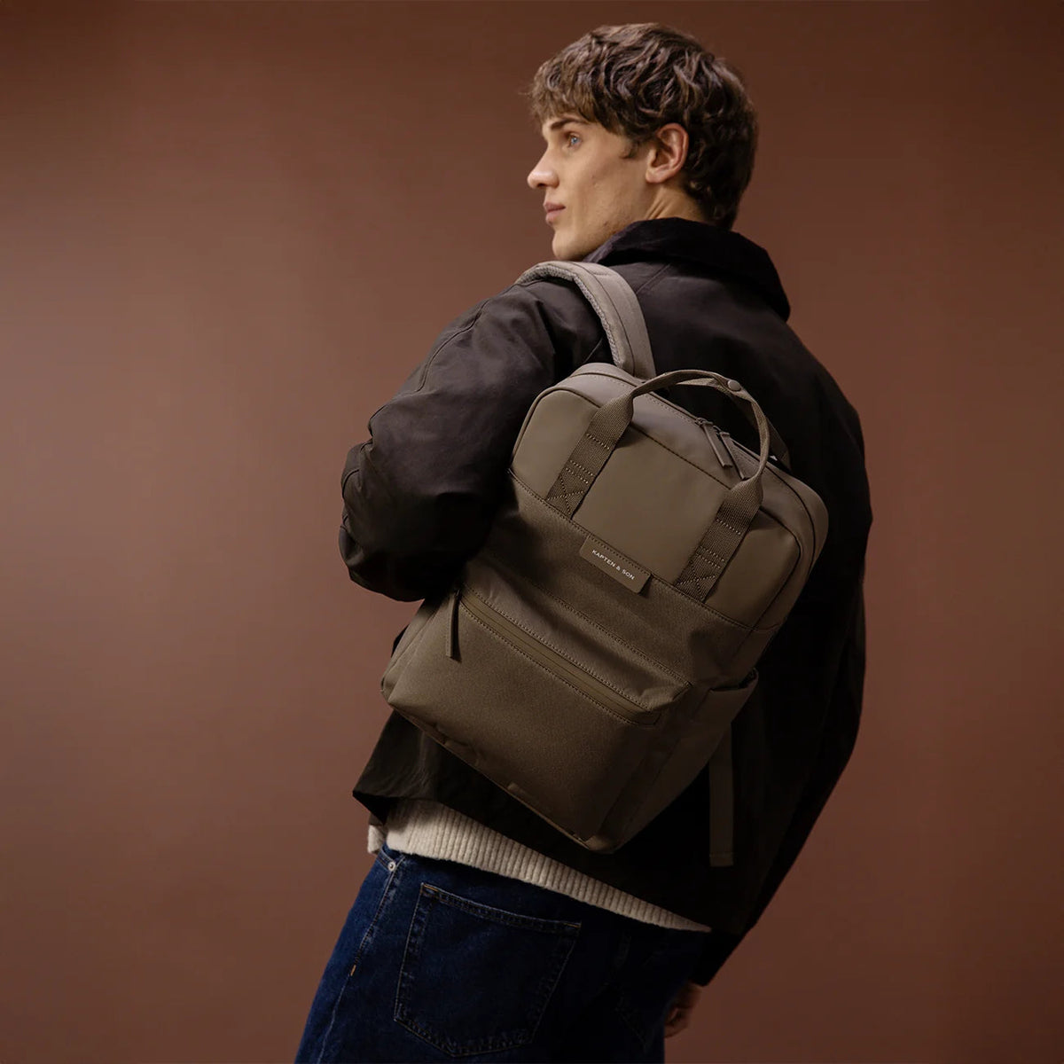 Man wearing the walnut Bergen Pro — rear view