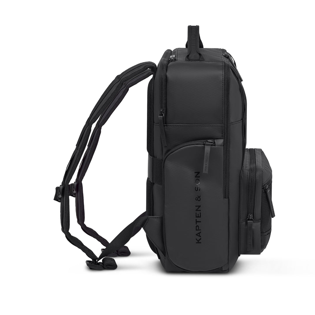 Kapten & Son Bergen Ultra backpack in All Black — side view with padded straps and dual side pockets