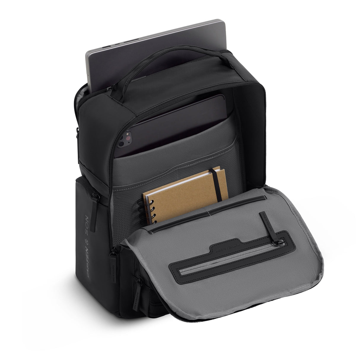 Bergen Ultra backpack packed with a laptop in the outer compartment, a tablet in the inner sleeve and a notebook in the mesh pocket