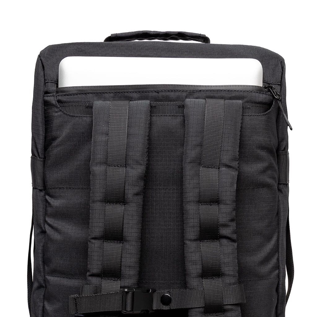 black eco friendly travel convertible backpack back close up laptop compartment view
