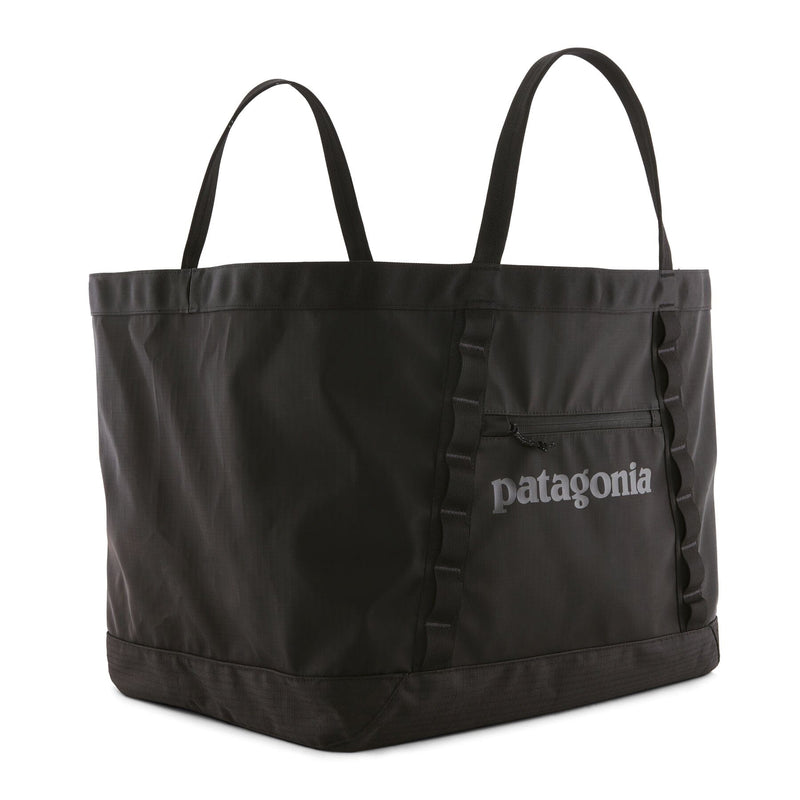 Black gear tote bag with Patagonia logo on a white background