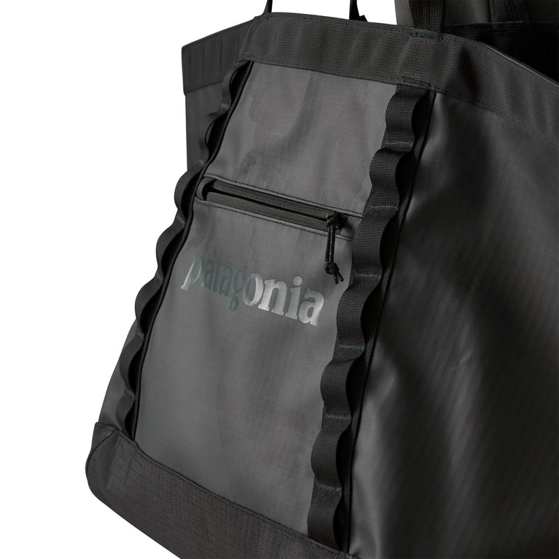 Black Patagonia tote bag with daisy webbing chain and recycled ripstop fabric details