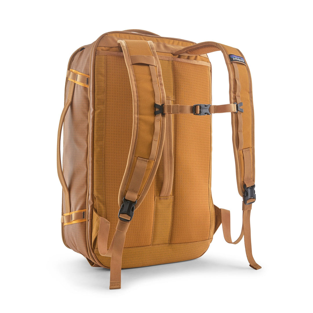 Black Hole Mini MLC 30L in Cinnamon Brown — back three-quarter view with the harness deployed