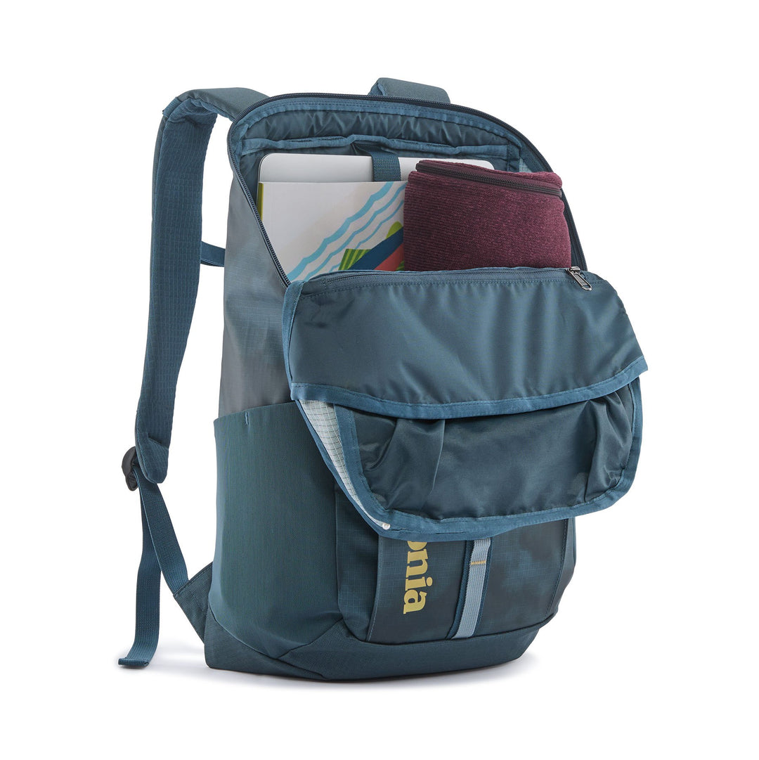 Black Hole Pack 25L in Sastrugi Summit Blue open showing the padded laptop sleeve and packed contents