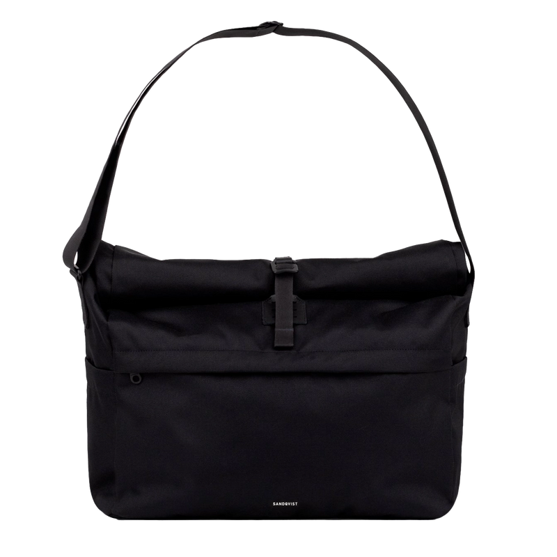 Sleek black messenger bag worn crossbody, ideal for commuting with a laptop and everyday essentials