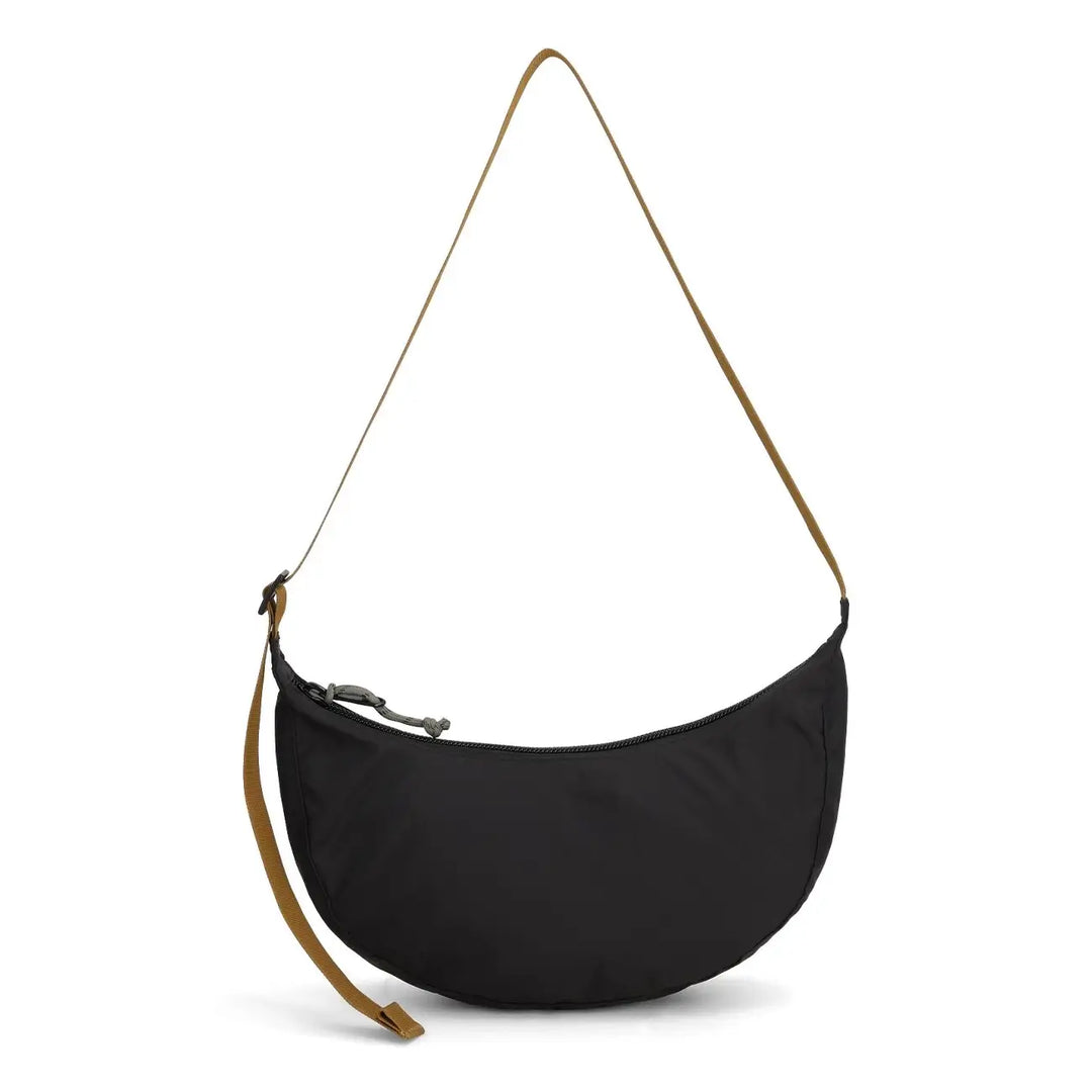Back of the black Moonlight crossbody bag by Topo Designs, sleek and minimalist crescent design