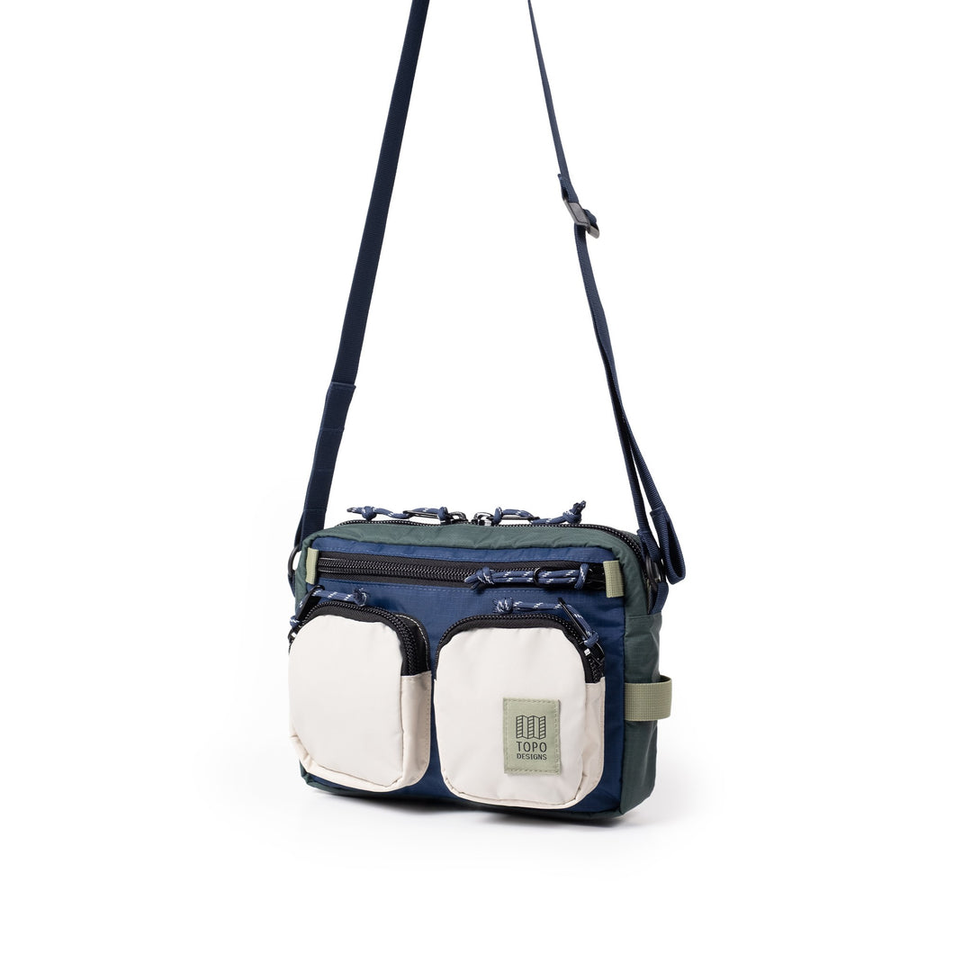Block Bag 3.5L in Forest and Bone White — three-quarter view showing the boxy silhouette