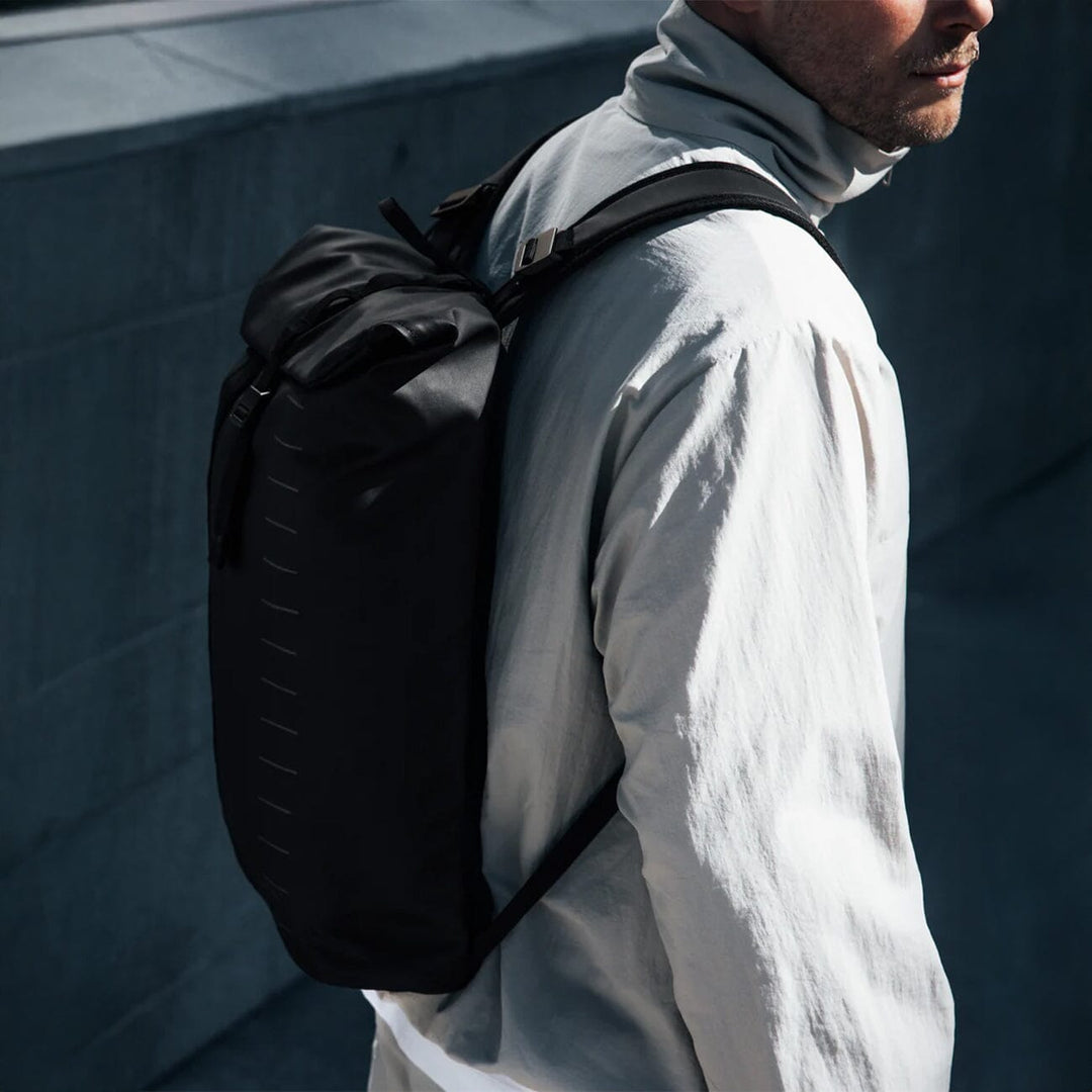 Essential Backpack 12L in black — three-quarter angle