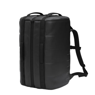 DB Journey Roamer Pro Split Duffel 50L in black — three-quarter angle with backpack straps