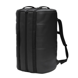 DB Journey Roamer Pro Split Duffel 70L in black — three-quarter angle with backpack straps
