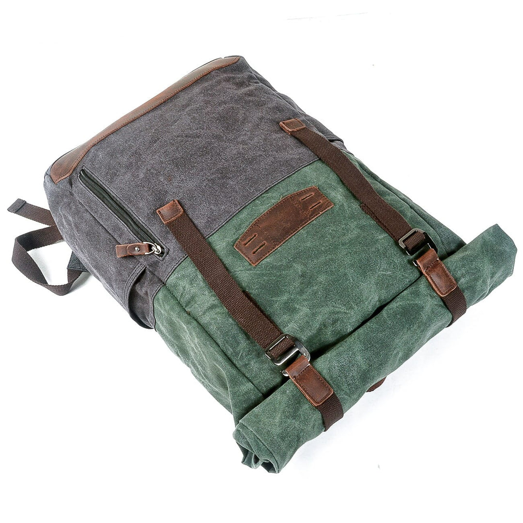 Bottom detail of the Dublin canvas knapsack revealing the canvas base and reinforced X-stitched seam