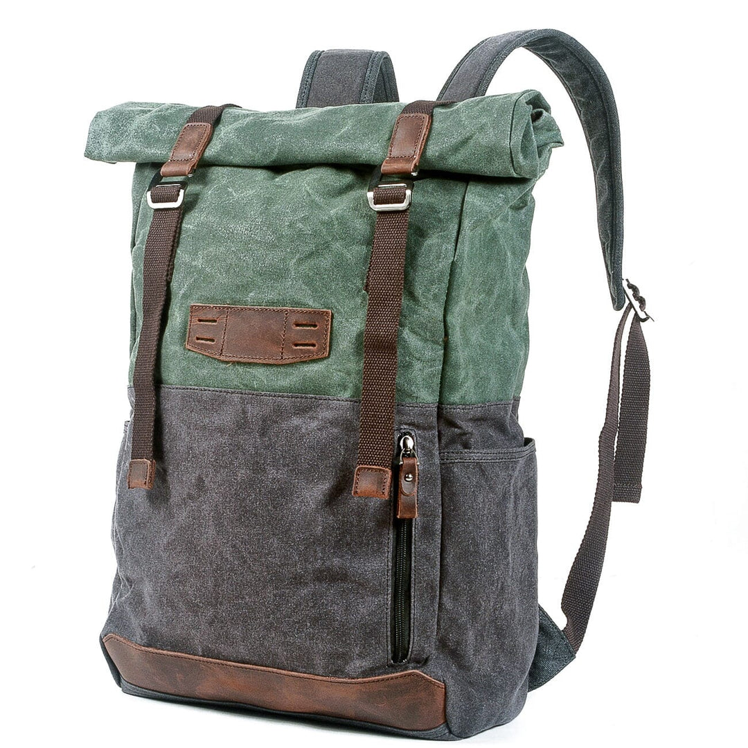 Macro of the antiqued brass buckle and leather strap closure on the Dublin canvas knapsack
