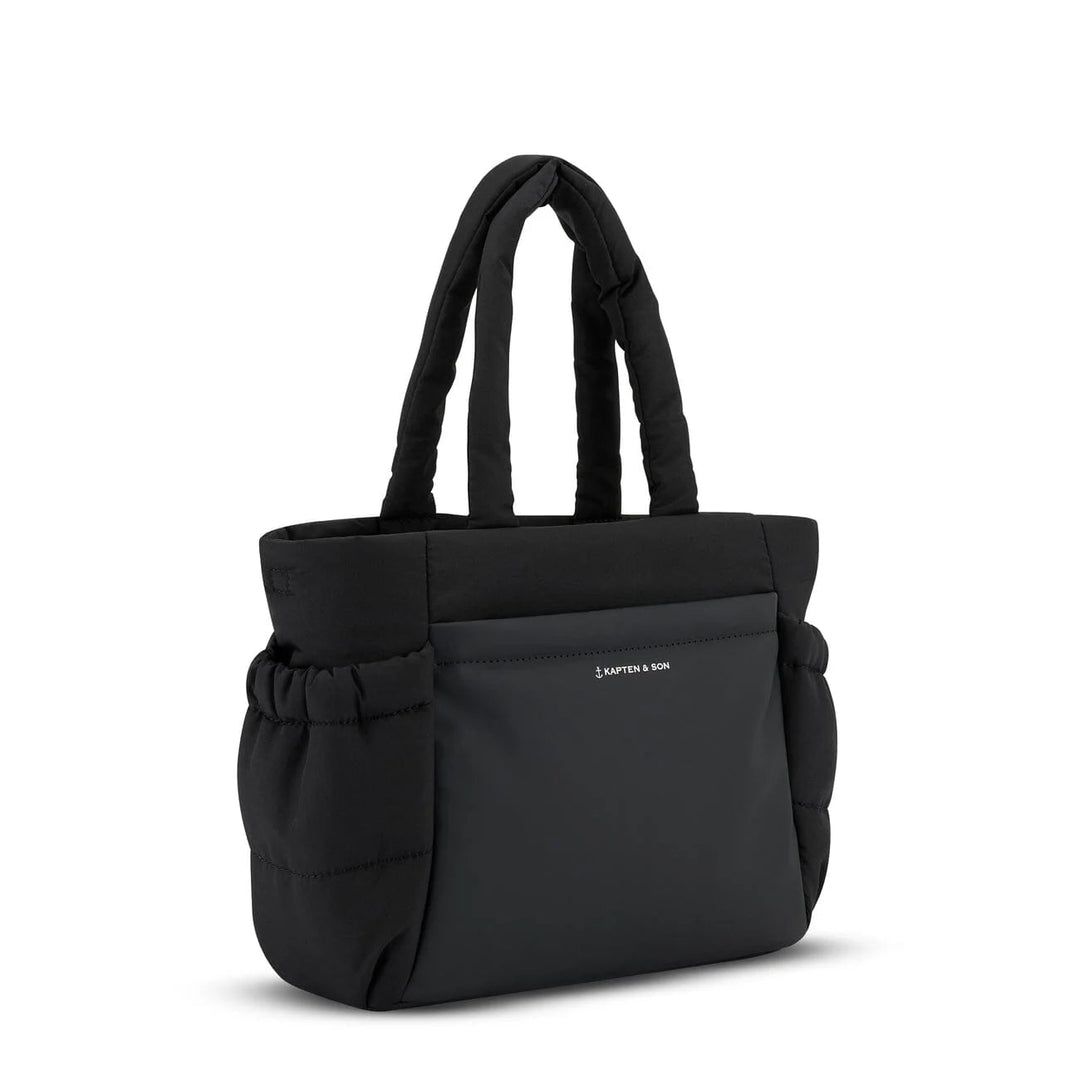 Side view with drawstring pocket and quilted puffer silhouette