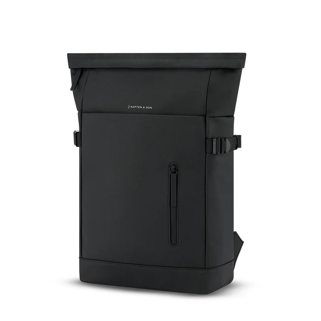 Three-quarter angle of the Helsinki rolltop in all black showing the waterproof-coated body and branded zip pull