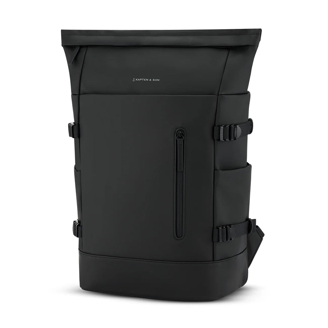 Three-quarter angle of the Helsinki Pro in all black showing the waterproof-coated body and front zip pocket