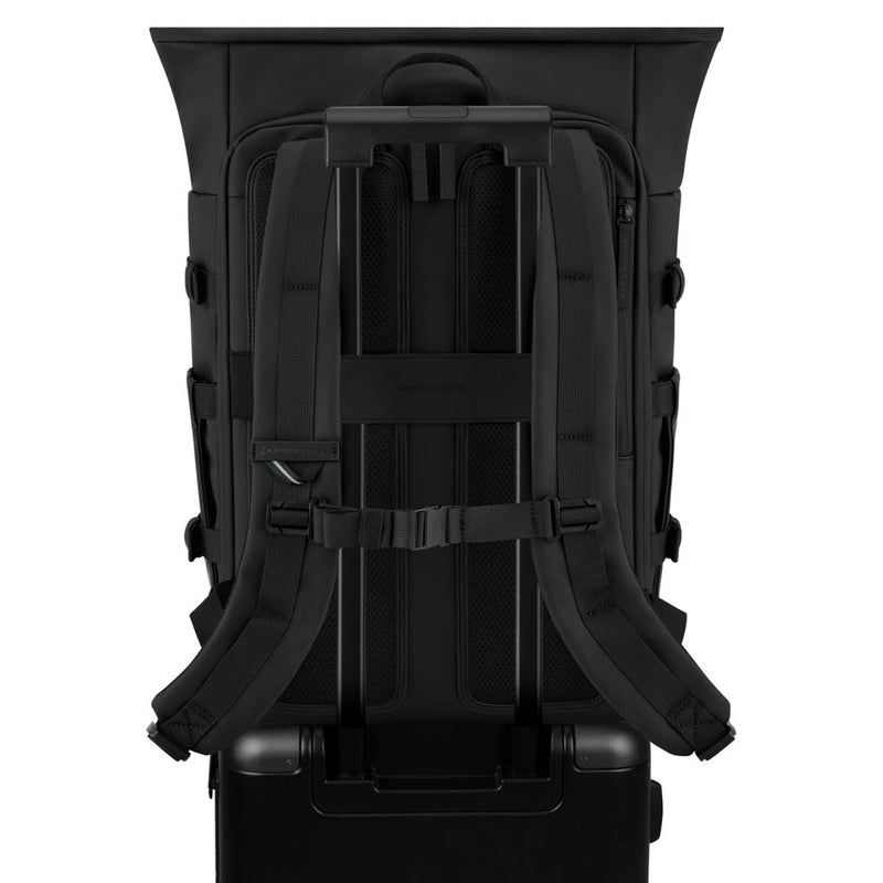 Helsinki Pro Bike slid over the handle of a suitcase with its luggage strap