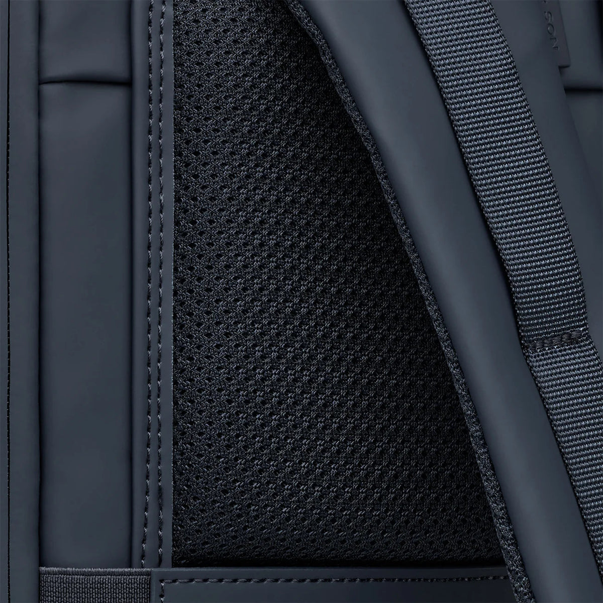 Padded back panel covered in breathable mesh on the navy Helsinki Pro
